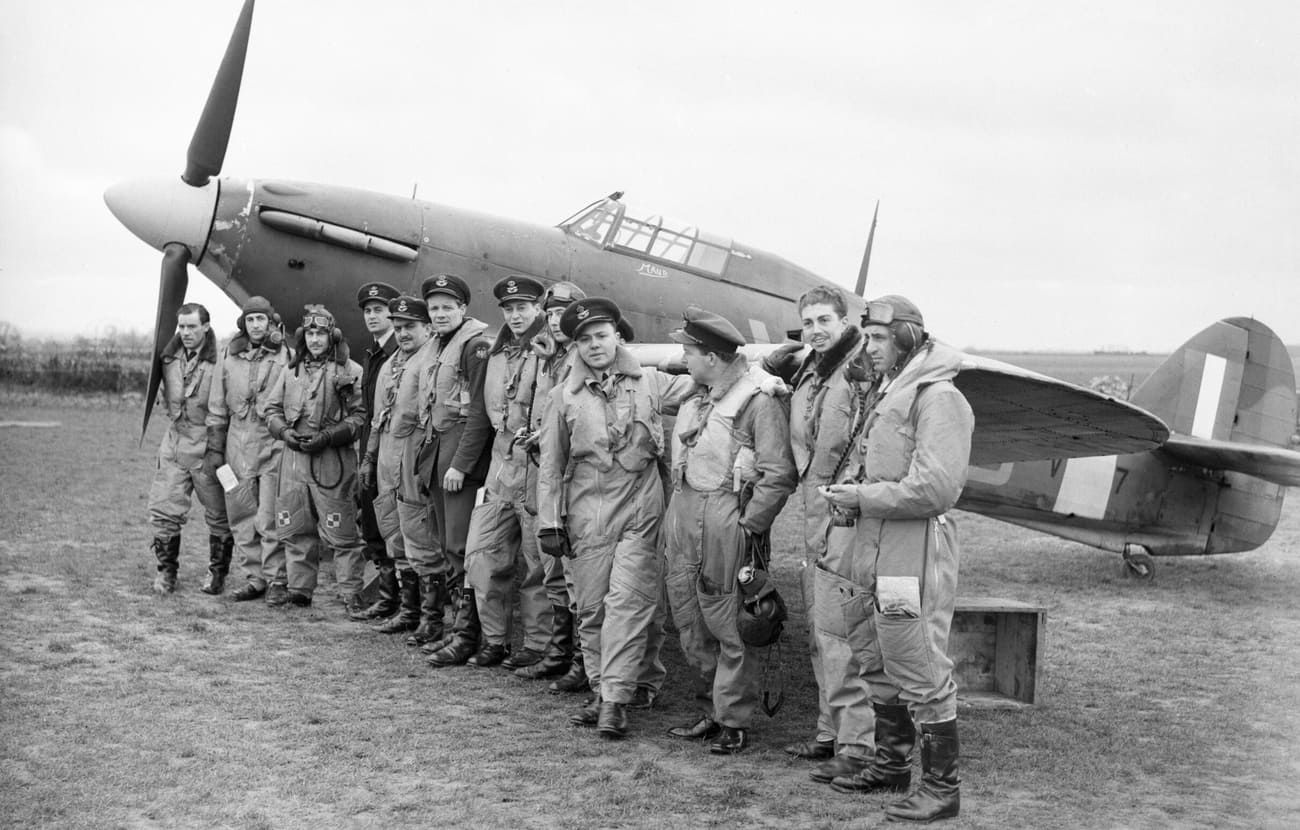 American pilots of No. 71 Eagle Squadron RAF gathered in front of one of their Hawker Hurricanes at Kirton in Lindsey Lincolnshire 17 March 1941. CH2403 1 1 1